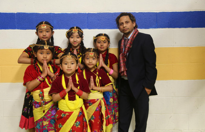 Young girls wearing a dance costume