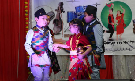 two kids dancing together