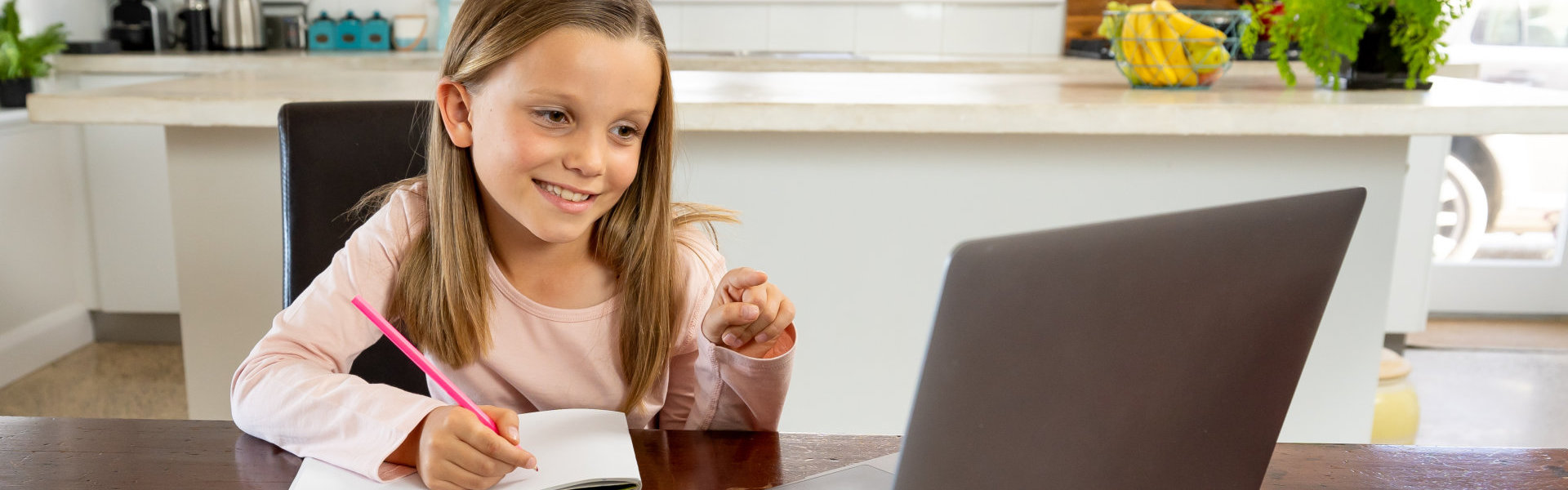 young girl taking online course