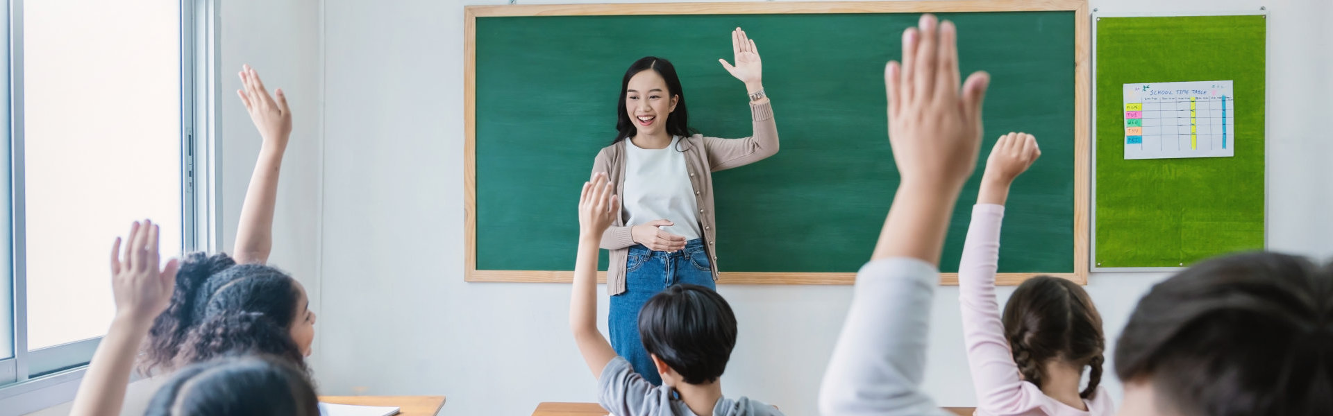 Students raising their hands